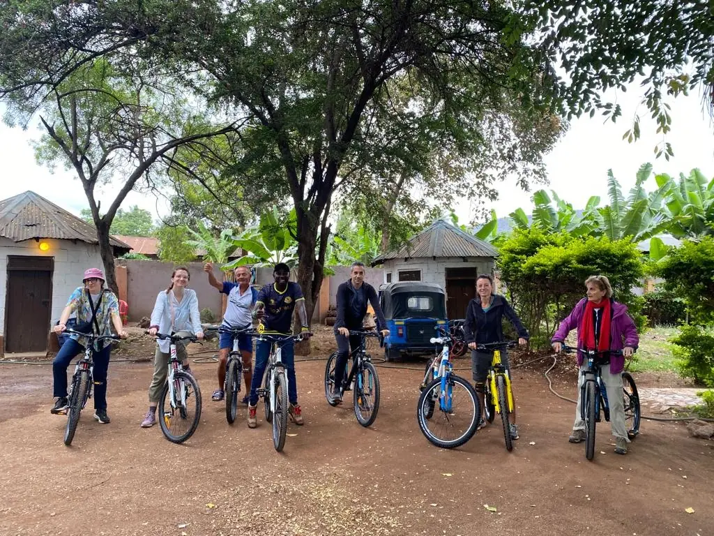 A group of cyclists lined up on their bicycles