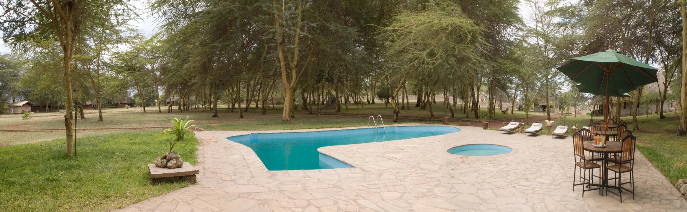 The two swimming pools among the acacias